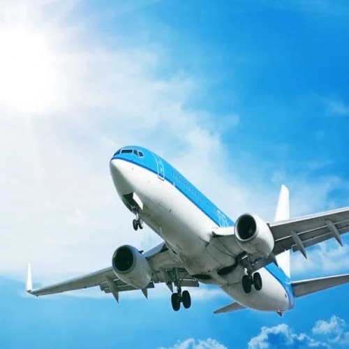 Airliner flying in a bright blue sky