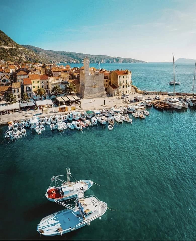 Harbor of a Dalmatian coastal town with fishing boats